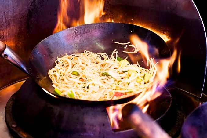 Awesome Chinese Food: A wok full of hakka noodles being sizzled over naked flame